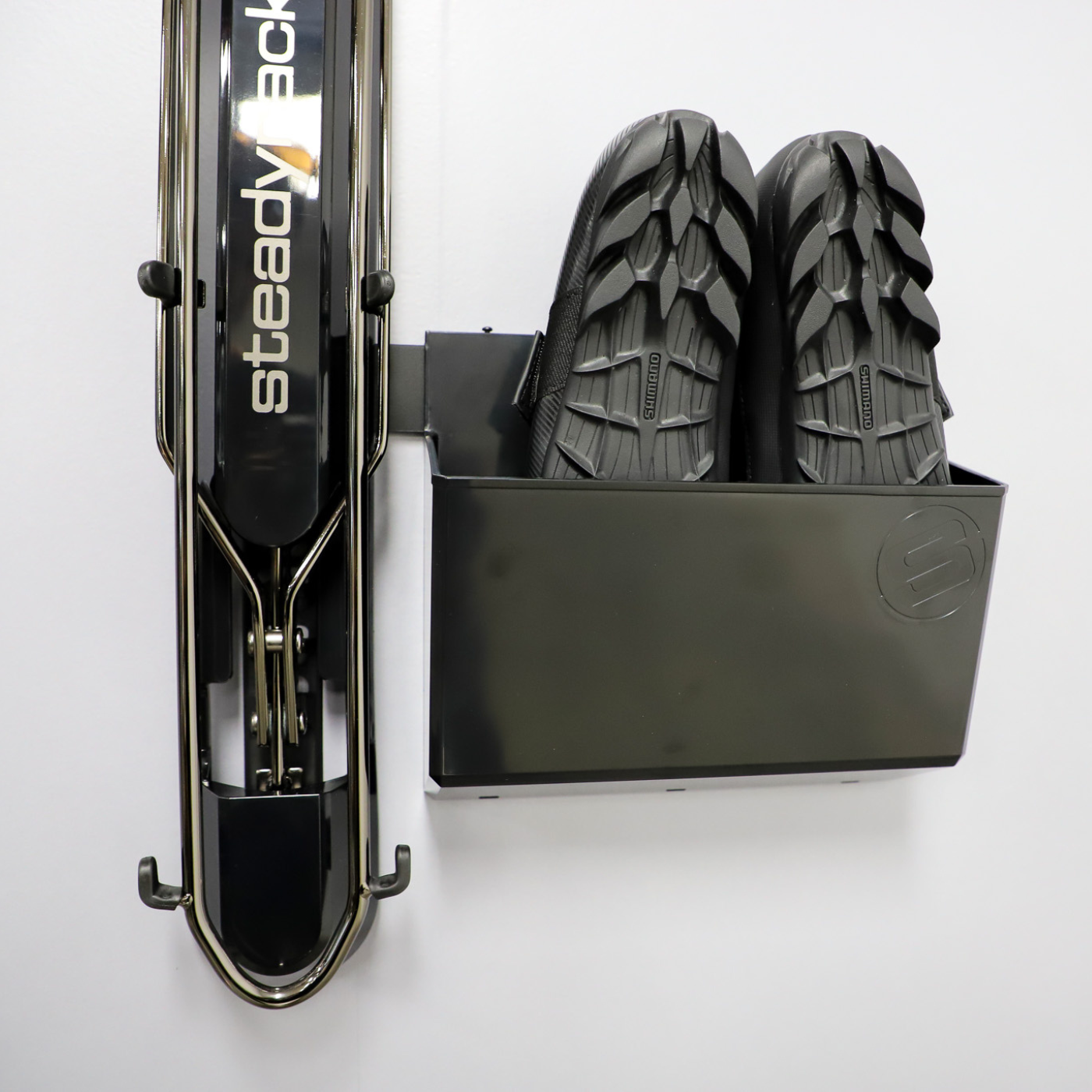 The GearMate Large Steady Bin storing a pair of cycling shoes. 